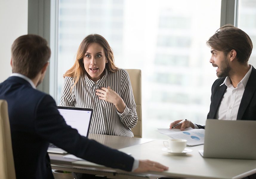 Angry man shouting at indignant female colleague. Angry man shouting at indignant shocked female colleague, blaming for mistake in front of boss. Disagreement, misunderstanding, bad negotiations, arguing, showing disrespect, gender discrimination.