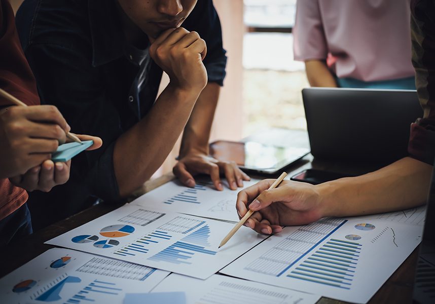 Asian business people meeting new startup project pointing graph Asian business people meeting new startup project pointing graph discussion and analysis data charts and graphs.Business finances and accounting concept