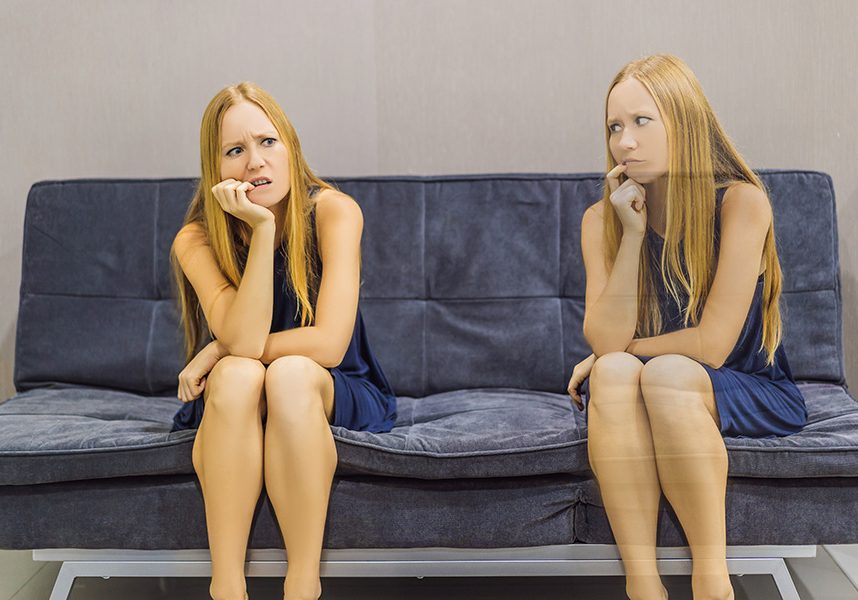Woman experiencing sad emotions and evaluate their emotions from the side. Emotional Intelligence Concept Woman experiencing sad emotions and evaluate their emotions from the side. Emotional Intelligence Concept.